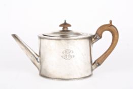 A George III oval silver teapothallmarked London 1786, with beaded rims and carved wooden handle