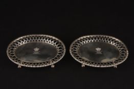 A small pair of Victorian silver oval card waitershallmarked London 1843, with central engraved