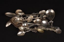 A collection of 19 assorted silver and white metal spoonsof various dates and styles, including two