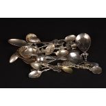 A collection of 19 assorted silver and white metal spoons
of various dates and styles, including two