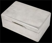 A rectangular polished hallmarked silver table cigarette box with hinged lid. hallmarked Sheffield