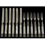 A set of six Victorian silver and mother of pearl handled dessert knives and forks hallmarked