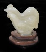 A 20th century Chinese jade carving of two stylised cockerels, on later stand height 5.5cmCondition: