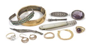 A small collection of mixed jewellery including a hinged bangle, garnet ring, earrings and a