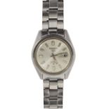 A Seiko automatic stainless steel wrist watch the silvered dial with luminous baton numerals and