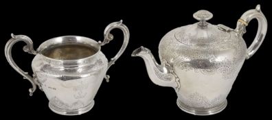 A George V silver teapot and a Victorian sugar bowl hallmarked London 1917 and 1846, with with