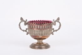 A WMF silver plated sugar bowl with ruby glass liner the bowl with twin scrolled handles and pierced