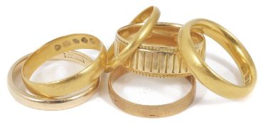 Three antique 22ct gold wedding bands, two 18ct gold wedding bands and a single 9ct gold wedding