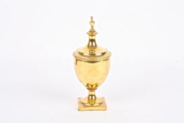An early 20th century Tiffany silver gilt urn and cover the lid with vase shaped finial and beaded
