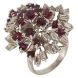 A large mid 20th Century ruby and diamond set cocktail ring of random spray design. The tiered white