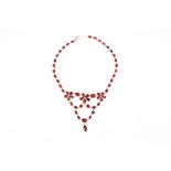 A Georgian flat cut garnet floral garland drop necklace, the chain linked garnets foil backed and
