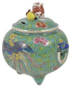 A 20th century Chinese famille rose incense burner and cover the lid crested with a dog of foe,