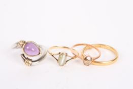 A large 18ct gold wedding band, two gold mounted simple dress ring and a large silver and tear