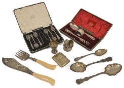A collection of assorted silver items including a cased set of silver teaspoons, a cased spoon, fork