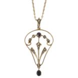 A delicate Edwardian amethyst and pearl open work scroll pendant of stylised foliate design, pearl