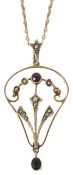 A delicate Edwardian amethyst and pearl open work scroll pendant of stylised foliate design, pearl