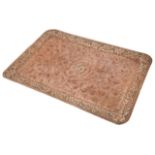 A large Arts & Crafts embossed copper tray the plain central field embossed with an initial L, the