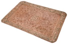 A large Arts & Crafts embossed copper tray the plain central field embossed with an initial L, the