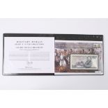 A Duke of Wellington £25 gold coin and a Five Pound note both in a fitted presentation folder