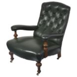 A Victorian oak button back library armchair, with dark green leather upholstered back, seat and