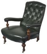 A Victorian oak button back library armchair, with dark green leather upholstered back, seat and