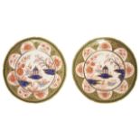 A pair of Swansea porcelain plates painted with a central Oriental scene of a fisher boy and