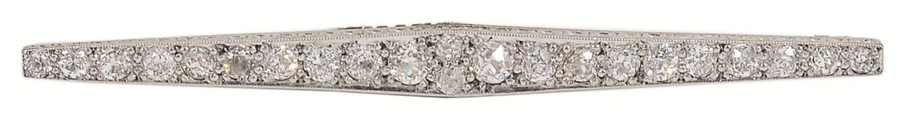 An Art Deco diamond set line brooch, the brooch tapering to either end and with scroll engraved