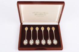 'The Sovereign Queens Spoon collection' a set of six silver and silver gilt commemorative spoons,