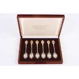 'The Sovereign Queens Spoon collection' a set of six silver and silver gilt commemorative spoons,