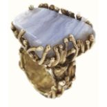 A large modernist design 9ct gold mounted agate dress ring, the heavy mount of abstract organic form