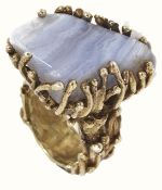 A large modernist design 9ct gold mounted agate dress ring, the heavy mount of abstract organic form