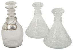 A Victorian cut lead glass decanter and a pair of silver decanter labels Cognac and Sherry, together