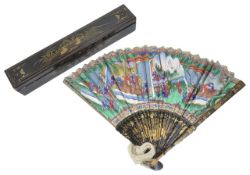 A 19th century Chinese Canton black lacquer and painted fan in case the front brightly and crisply