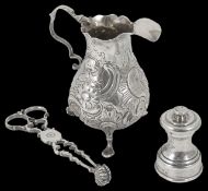 A George III embossed silver cream jug hallmarked London c.1776, with scrolled handle and
