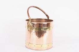 A copper coal bucket with brass bands to side height with handle 44cmCondition: in good overall