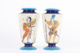 A pair of Boch Freres style pottery vases decorated with full-length stylised polychrome portraits