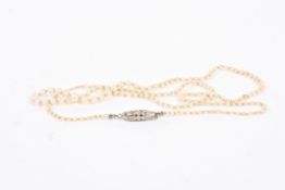 A delicate Victorian/Edwardian single strand graduated pearl necklace with rose diamond set clasp of