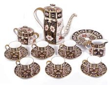 A Royal Crown Derby Imari pattern coffee service comprising coffee pot, six coffee cans and saucers,
