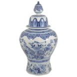 A very large early 20th century Delft blue and white jar and cover decorated with birds in
