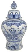 A very large early 20th century Delft blue and white jar and cover decorated with birds in