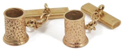 A pair of amusing 9ct gold hallmarked novelty cufflinks in the form of planished tankards. Makers