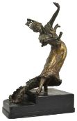 A large early 20th century French bronze figure of a dancer the lady wearing a long flowing dress,