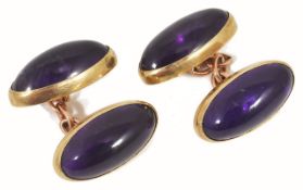 A pair of elegant Art Deco amethyst gold mounted cufflinks, each cufflink set with twin oval