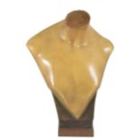 A large wax mannequin bust signed 'Elegan', supported on a wooden square pedestal. 48 cm high.