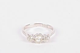 A three stone diamond set ring, the central diamond size just under 0.50 ct and flanked by a smaller