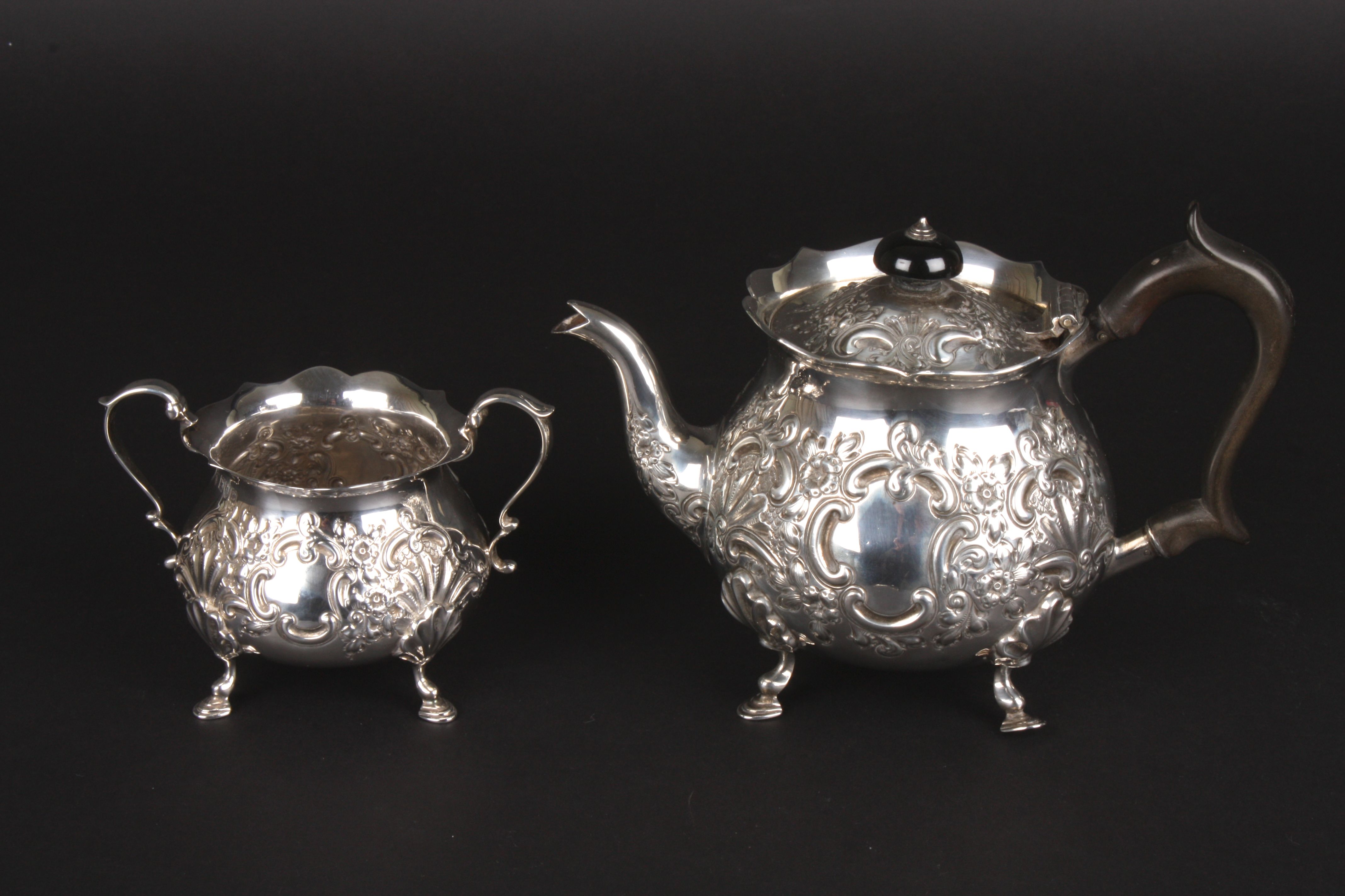 A Victorian two piece tea set, hallmarked London 1898, comprising a teapot and sugar bowl, with