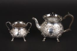 A Victorian two piece tea set, hallmarked London 1898, comprising a teapot and sugar bowl, with