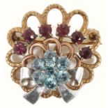 A 1940's style three colour gold gem set cocktail brooch of circular scroll design with ribbon