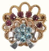 A 1940's style three colour gold gem set cocktail brooch of circular scroll design with ribbon