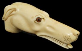 An ivory walking stick/umbrella handle in the form of a dog late 19th, early 20th century